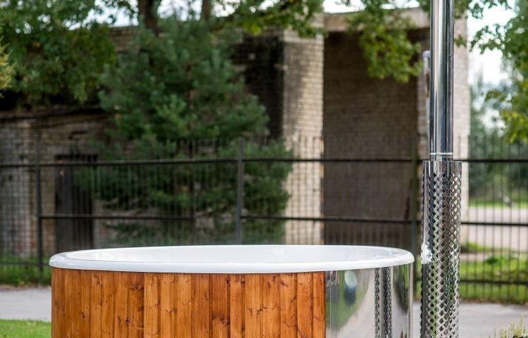 Fiberglass hot tub with integrated heater