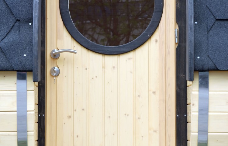 Sauna barrel with side entrance Outside door with round window 